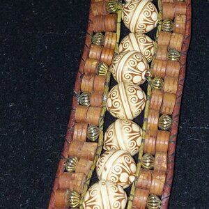 Leather bound Wrap bracelet from wooden and plastic beads with button closure